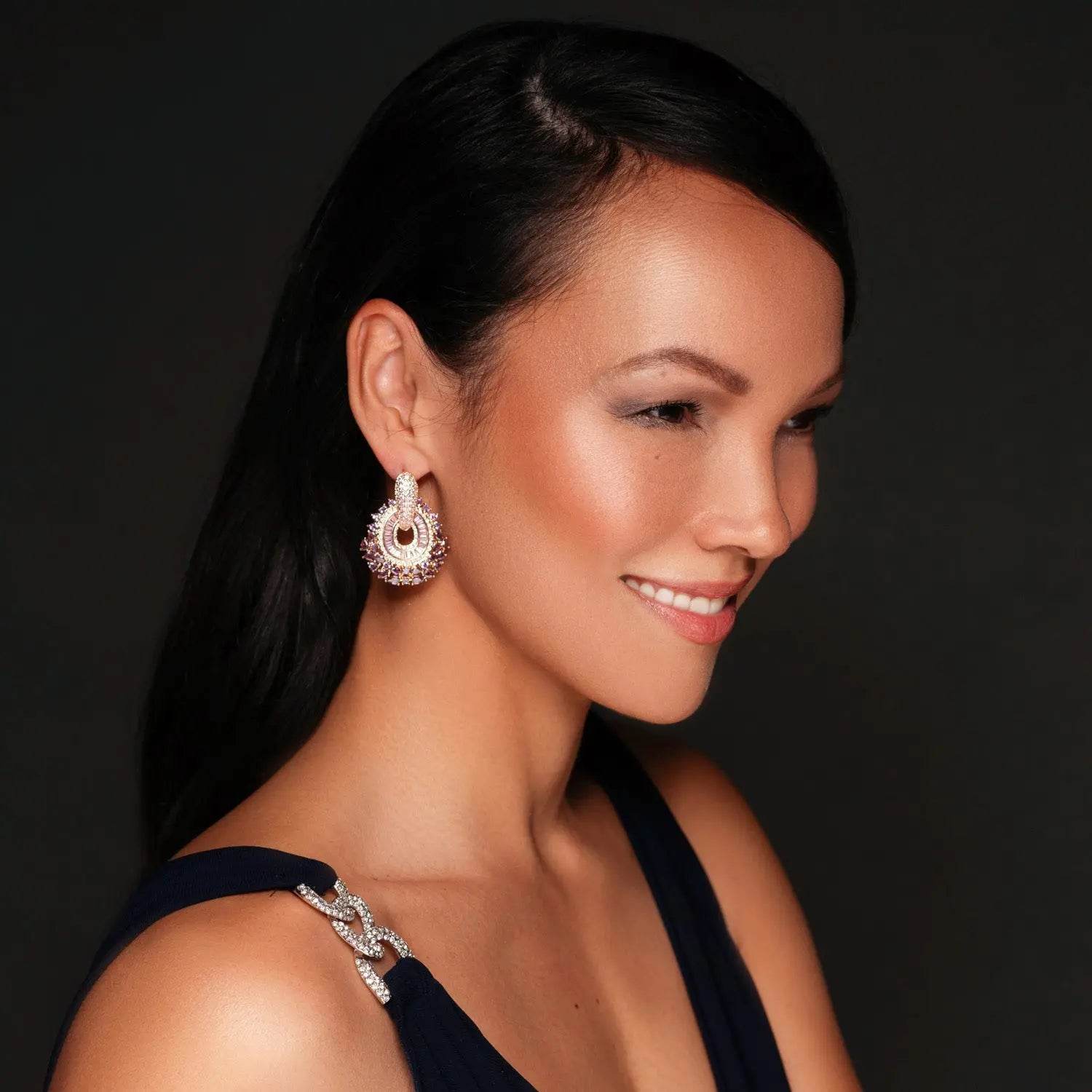 Rose gold-colored earrings with pink zirconias