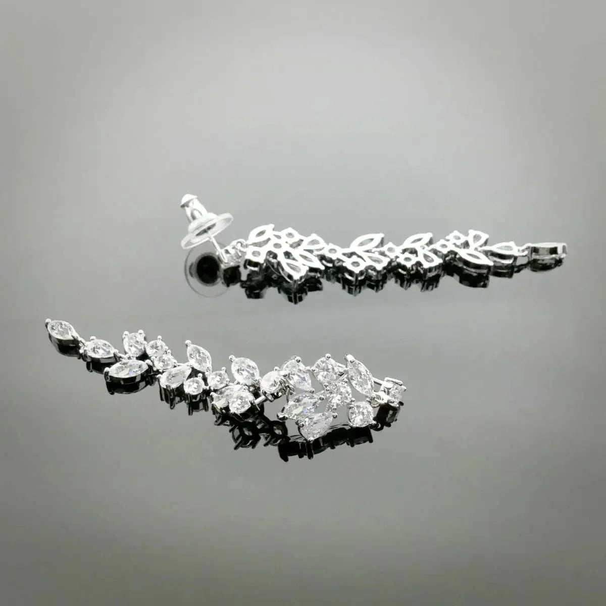 Silver-colored leaf dance earrings with zirconia