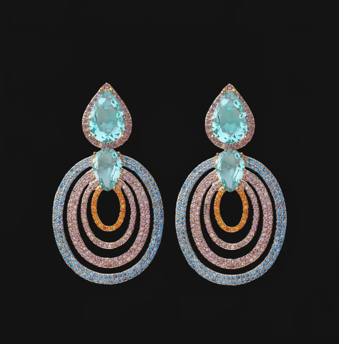 Rose gold colored earrings with turquoise colored zirconias