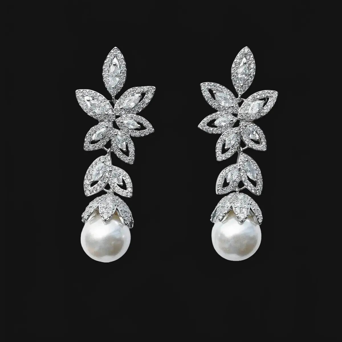 Silver-colored flower earrings with pearls and zirconias